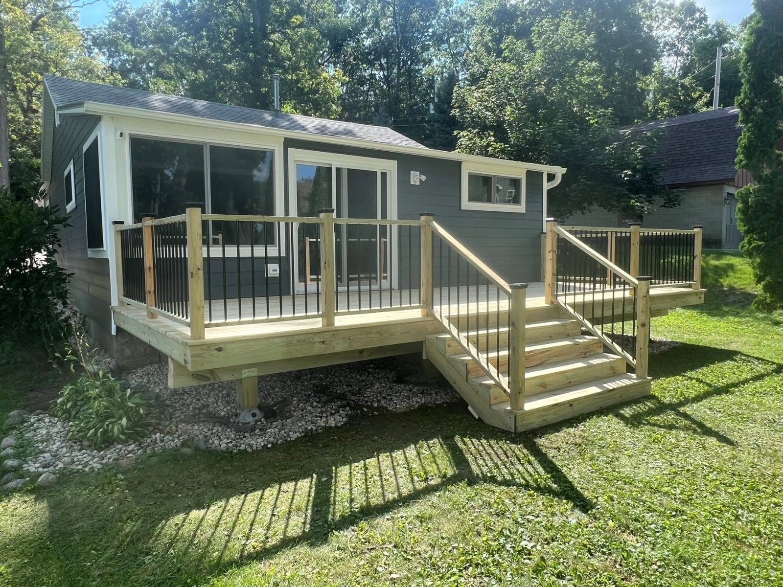 New pressure-treated deck with stairs and railings