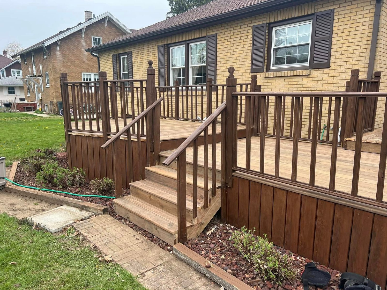 Wood deck and stairs on a brick home