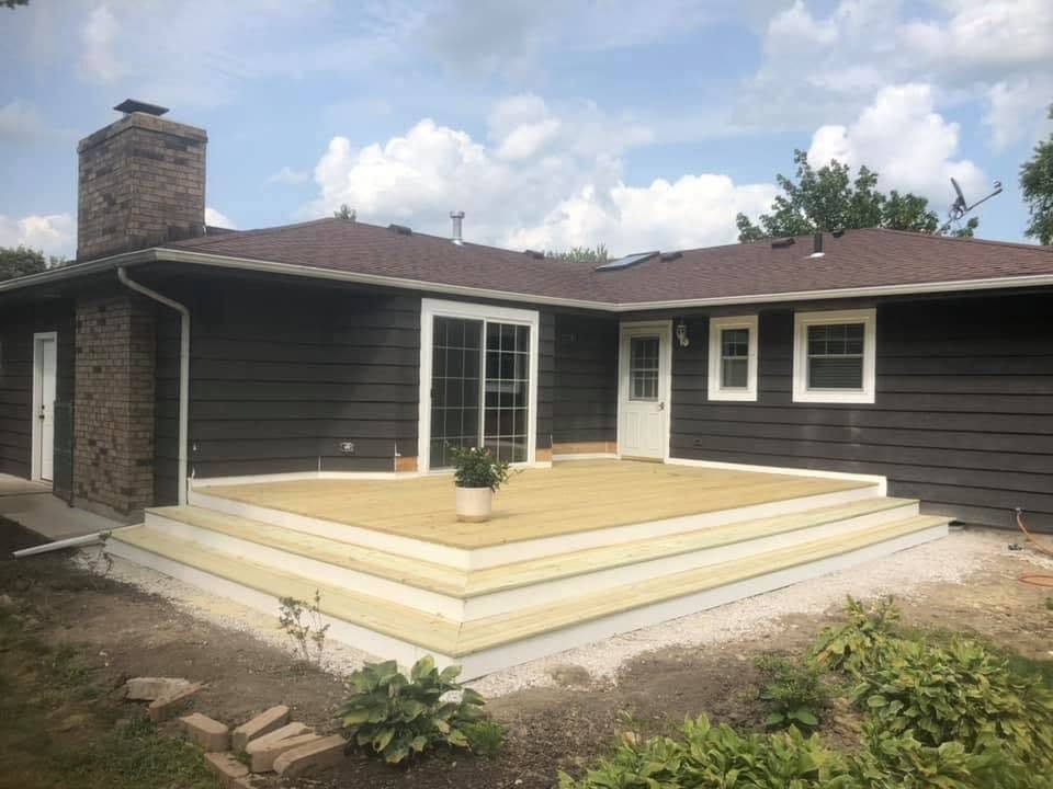 New deck on a gray ranch home